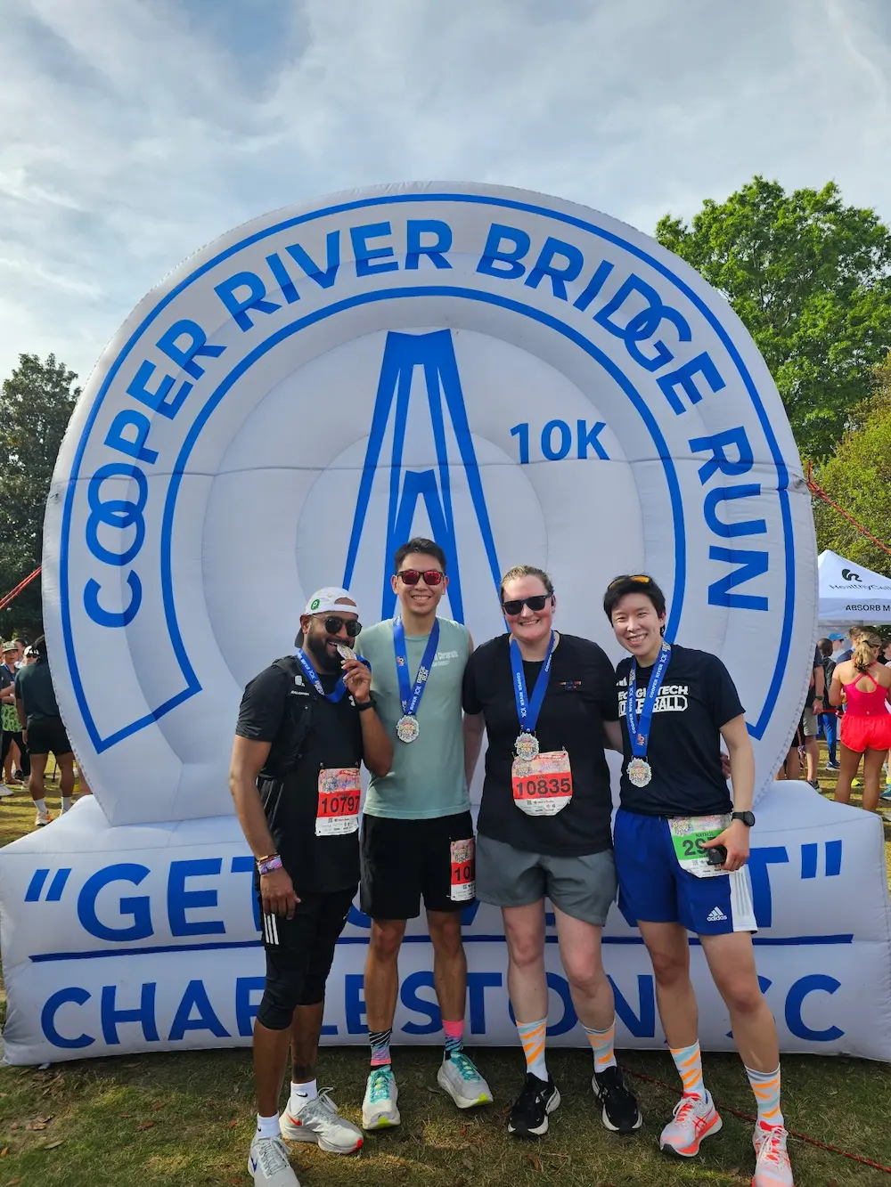 Runners celebrating at Cooper River Bridge Run finish.