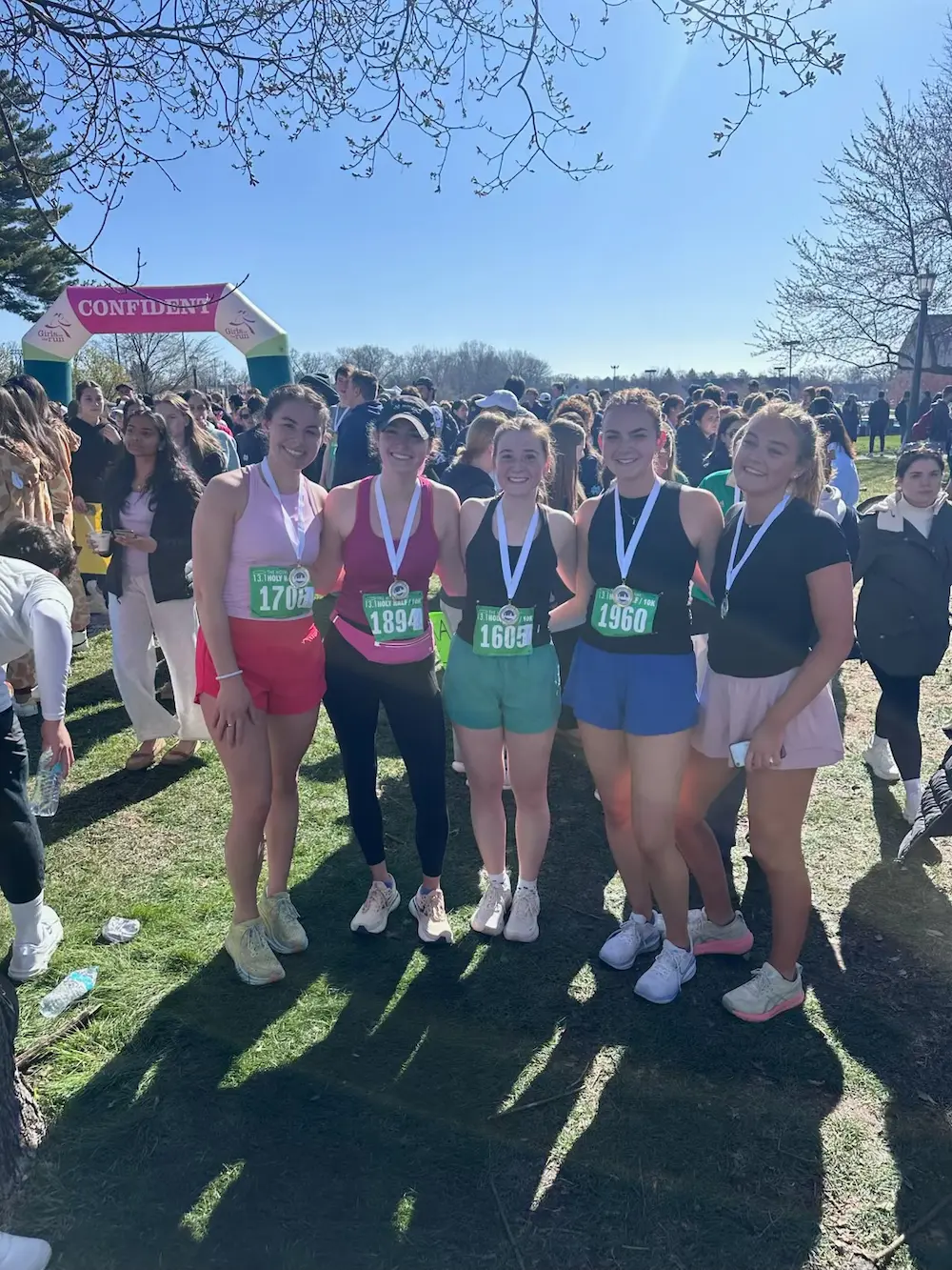 Group of runners with medals after race
