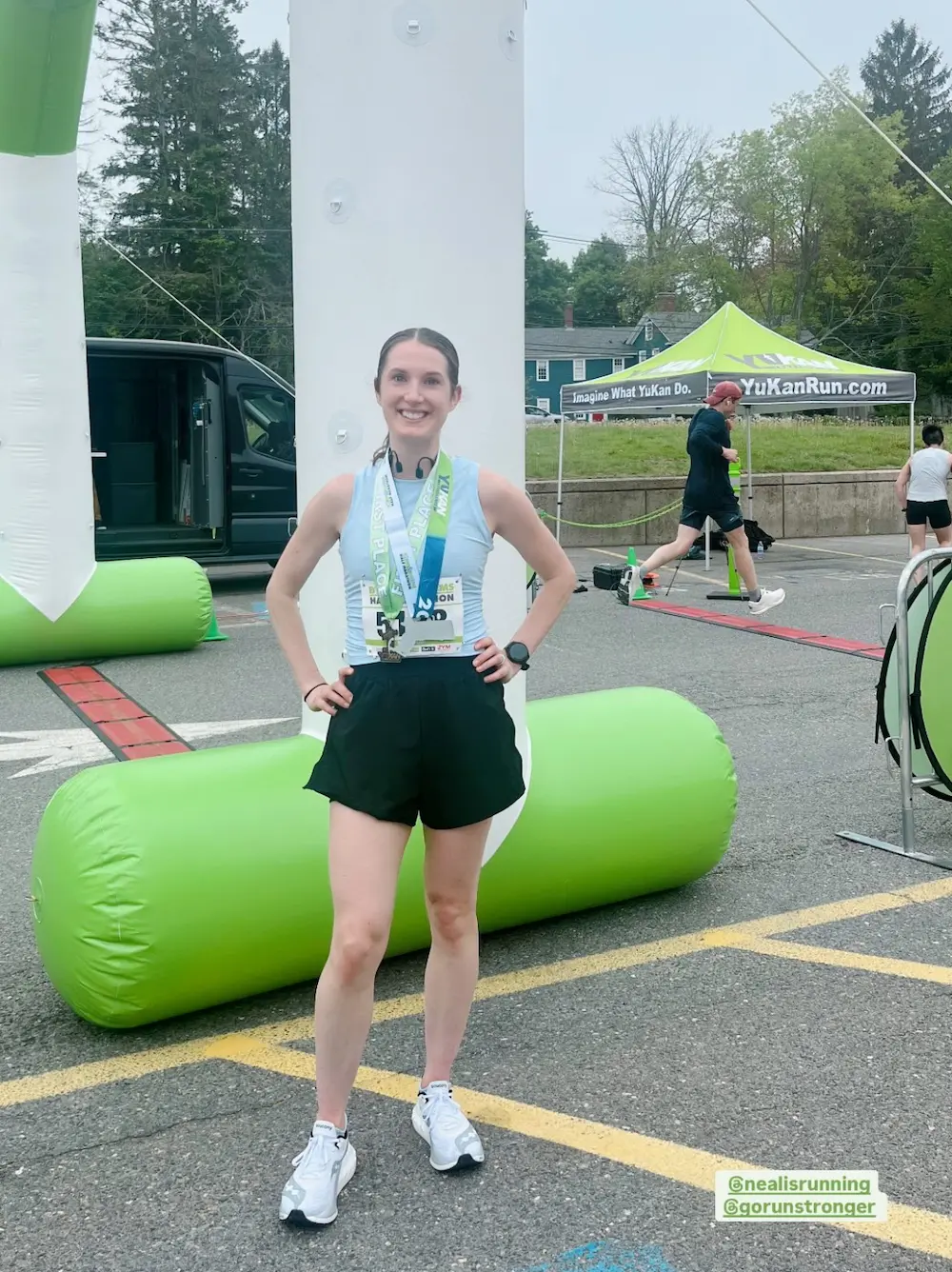 Woman smiling after completing a half marathon.