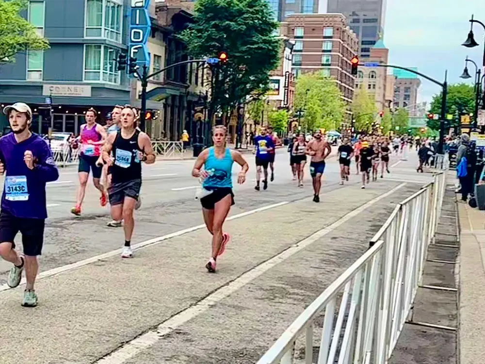 Group of runners in city marathon event.