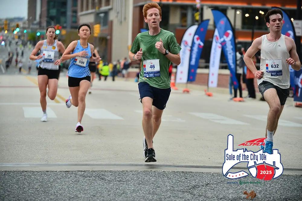 Runners competing in Sole of the City 10K race.